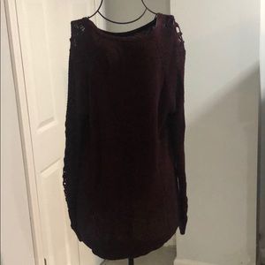 Maroon sweater with detail on sleeve